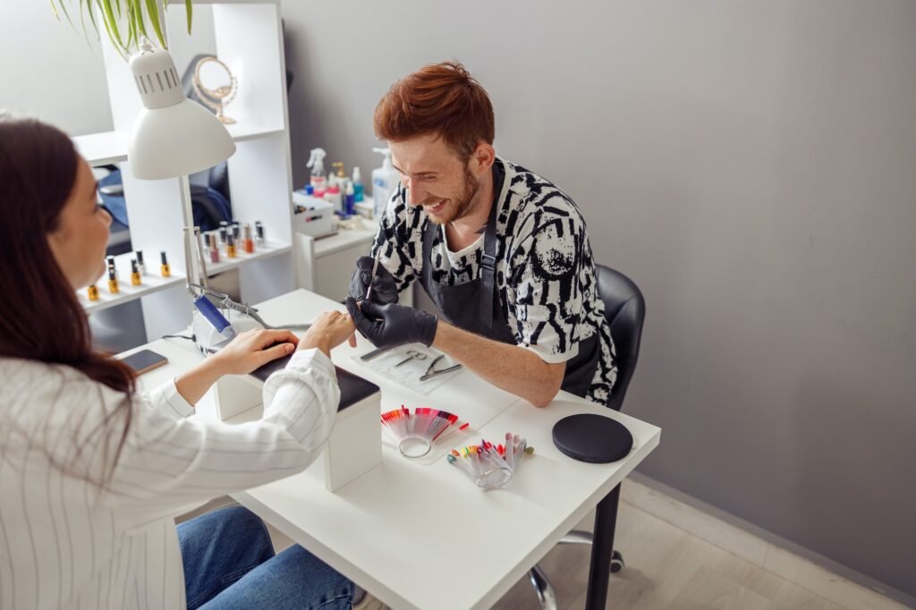 Caucasian woman getting nail manicure in beauty shop